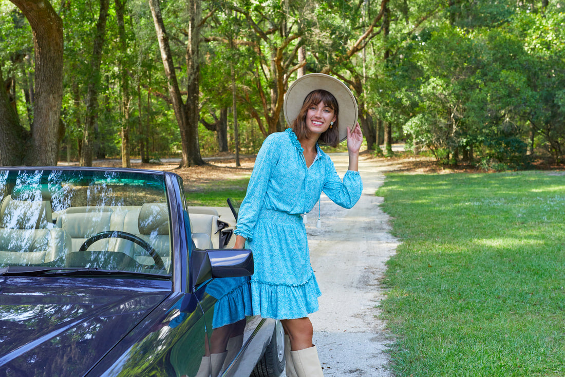 Woman wearing dress walking by lake