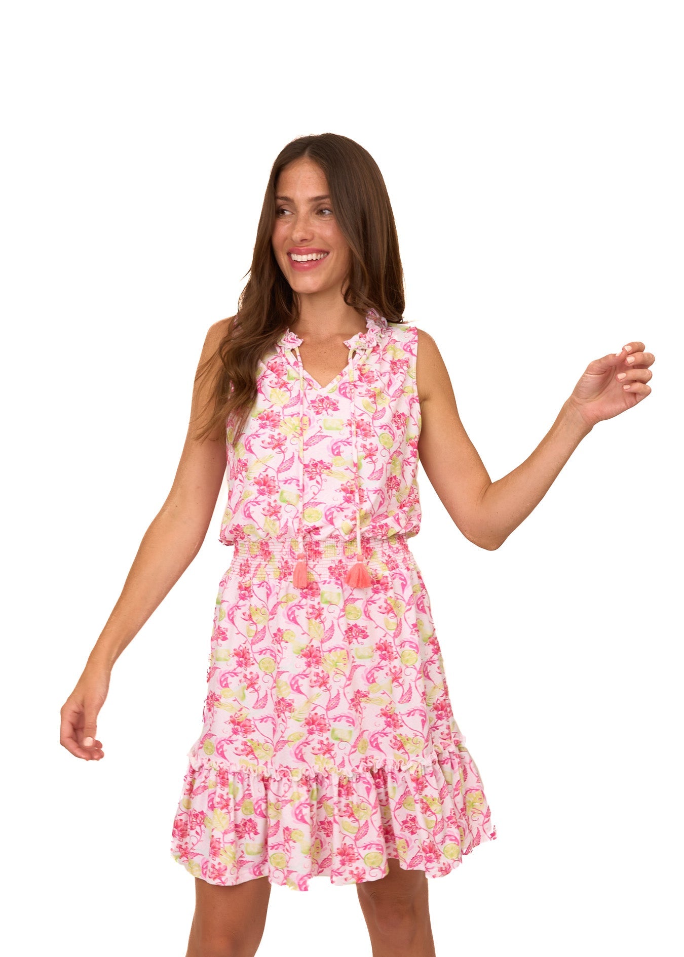 A brunette woman wearing the sun protective Margarita Smocked Waist Dress from Cabana Life on a white background.