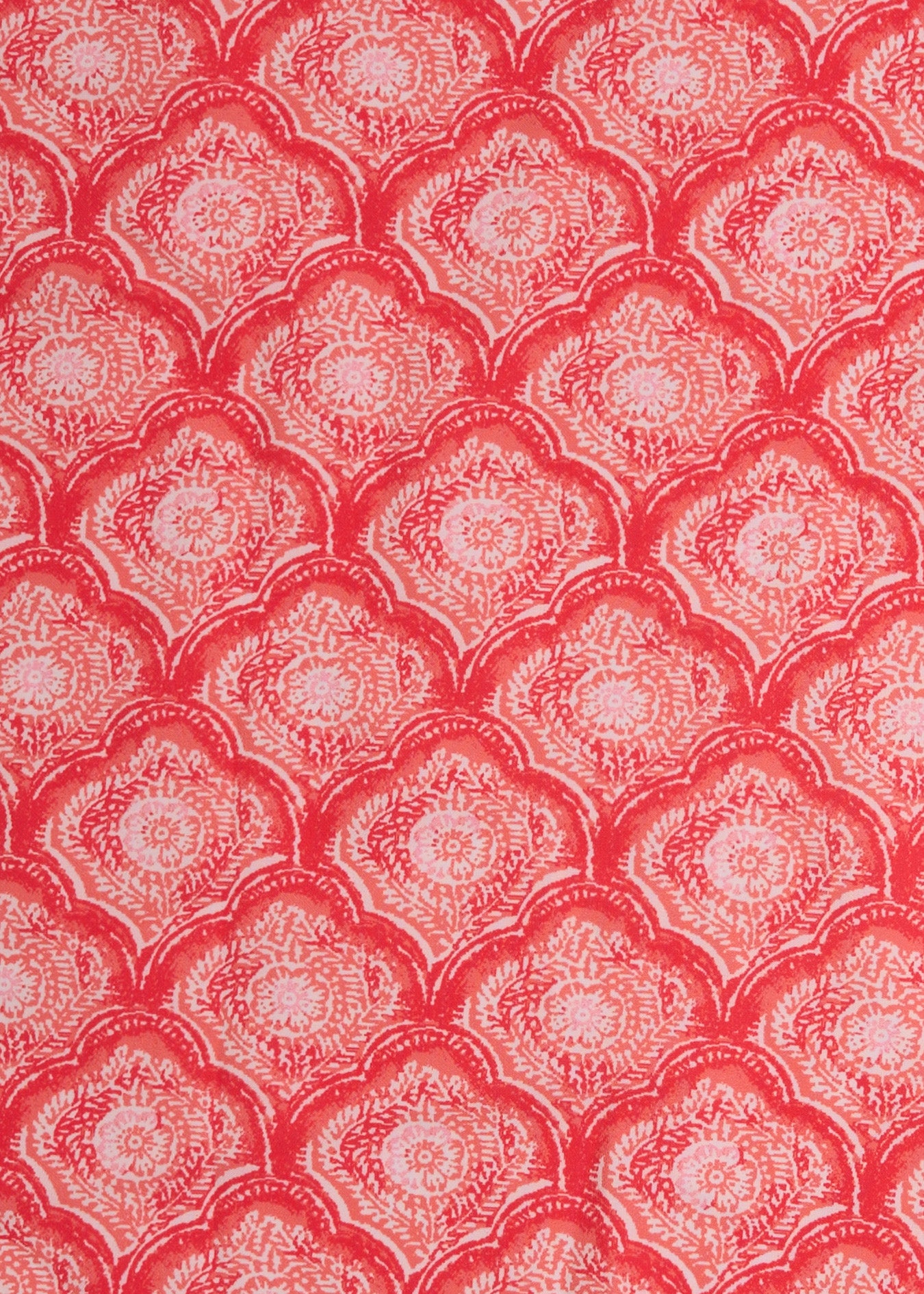 A close up of Cabana Life's Amelia Island pink and coral colored tile print on a UPF 50+ fabric.