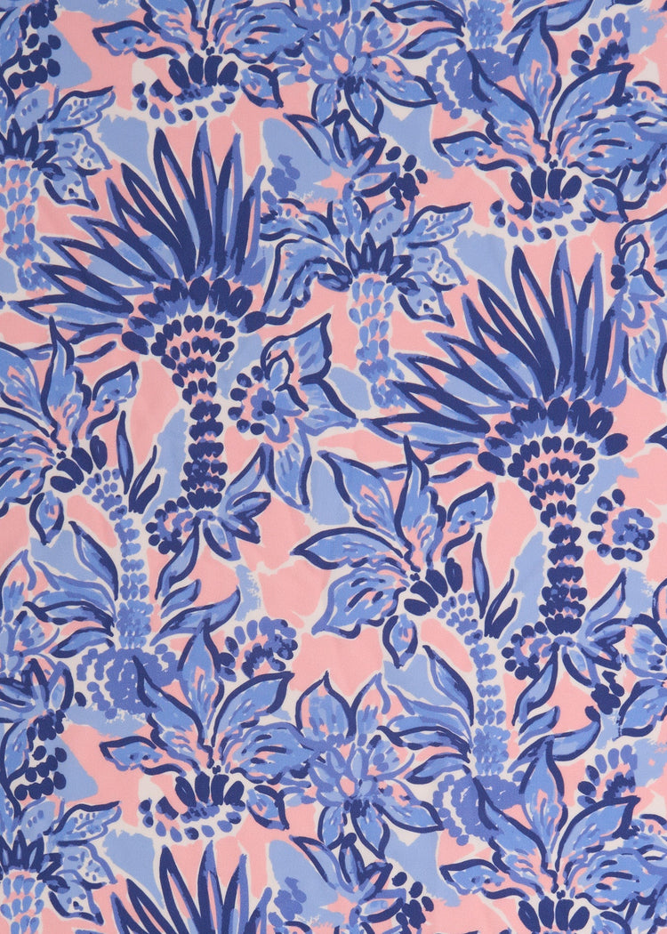 A close up of the UPF 50+ palm print fabric on the Cabana Life Palm Beach Ruched One-Piece.