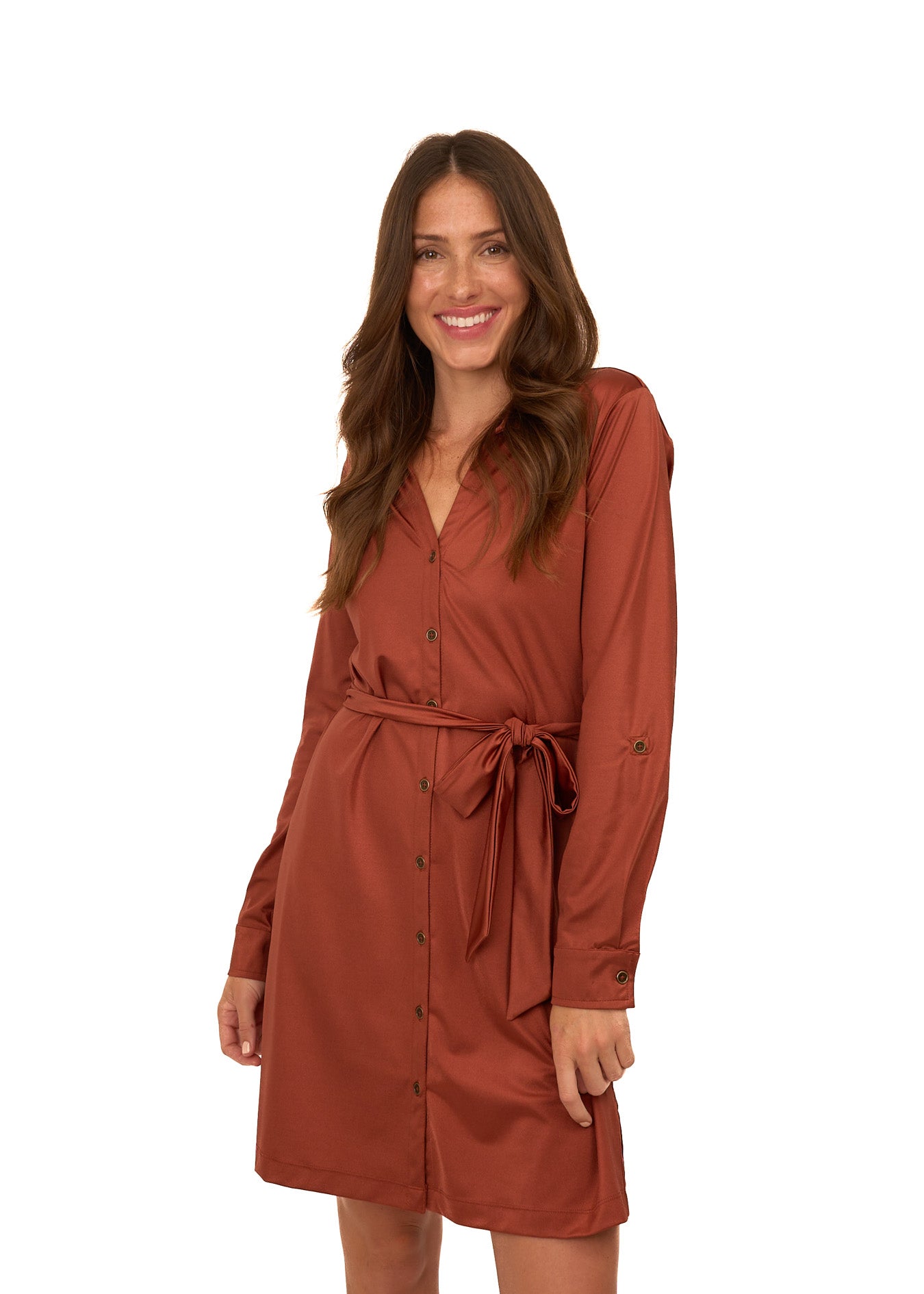 A brunette woman wearing Cabana Life's sun protective Copper Button Down Shirt Dress on a white background.