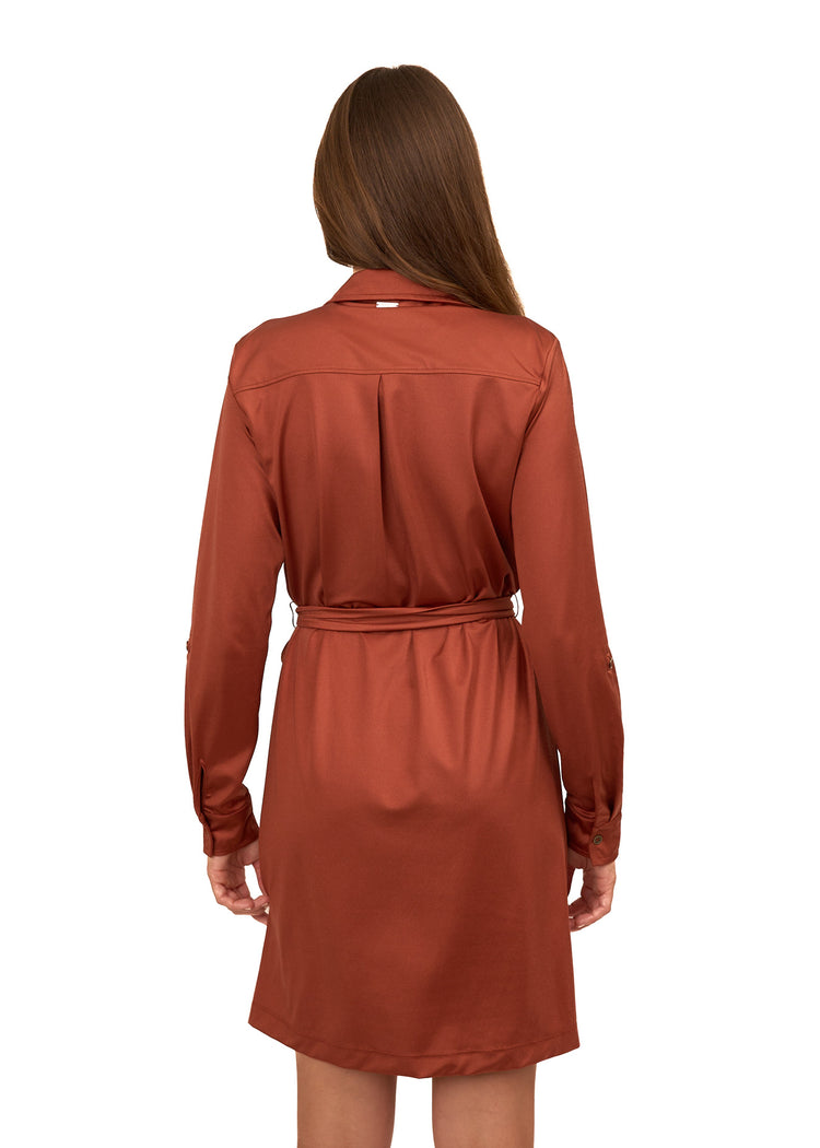 The back of a brunette woman wearing Cabana Life's sun protective Copper Button Down Shirt Dress on a white background.