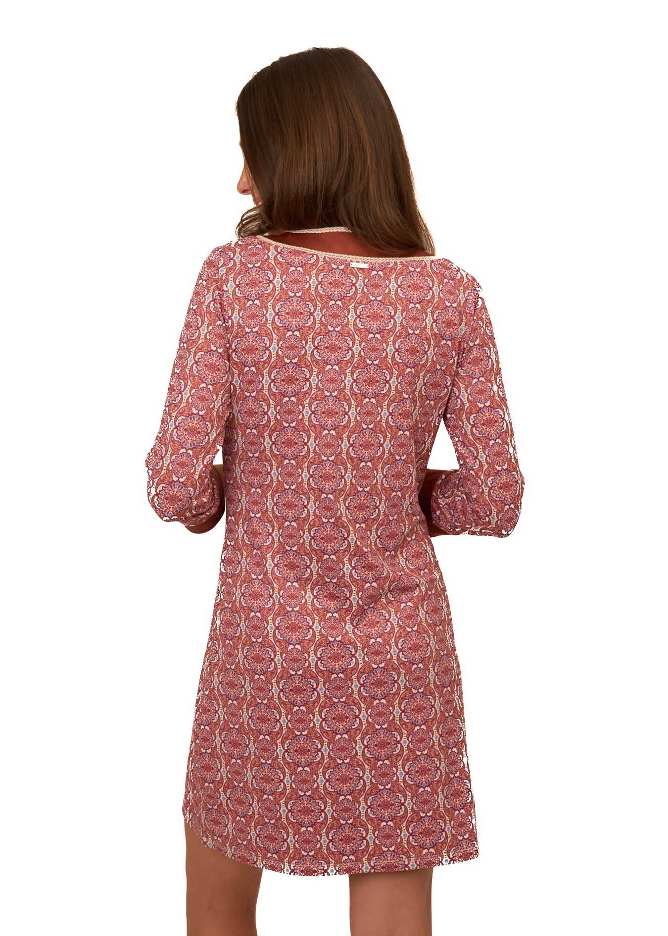 The back of a brunette woman wearing Cabana Life's sun protective Camden Geo Embroidered Tunic Dress on a white background.