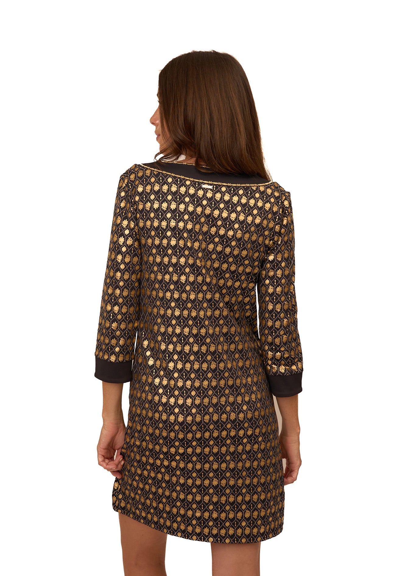 The back of a brunette woman wearing Cabana Life's sun protective Black Metallic Tunic Dress on a white background.