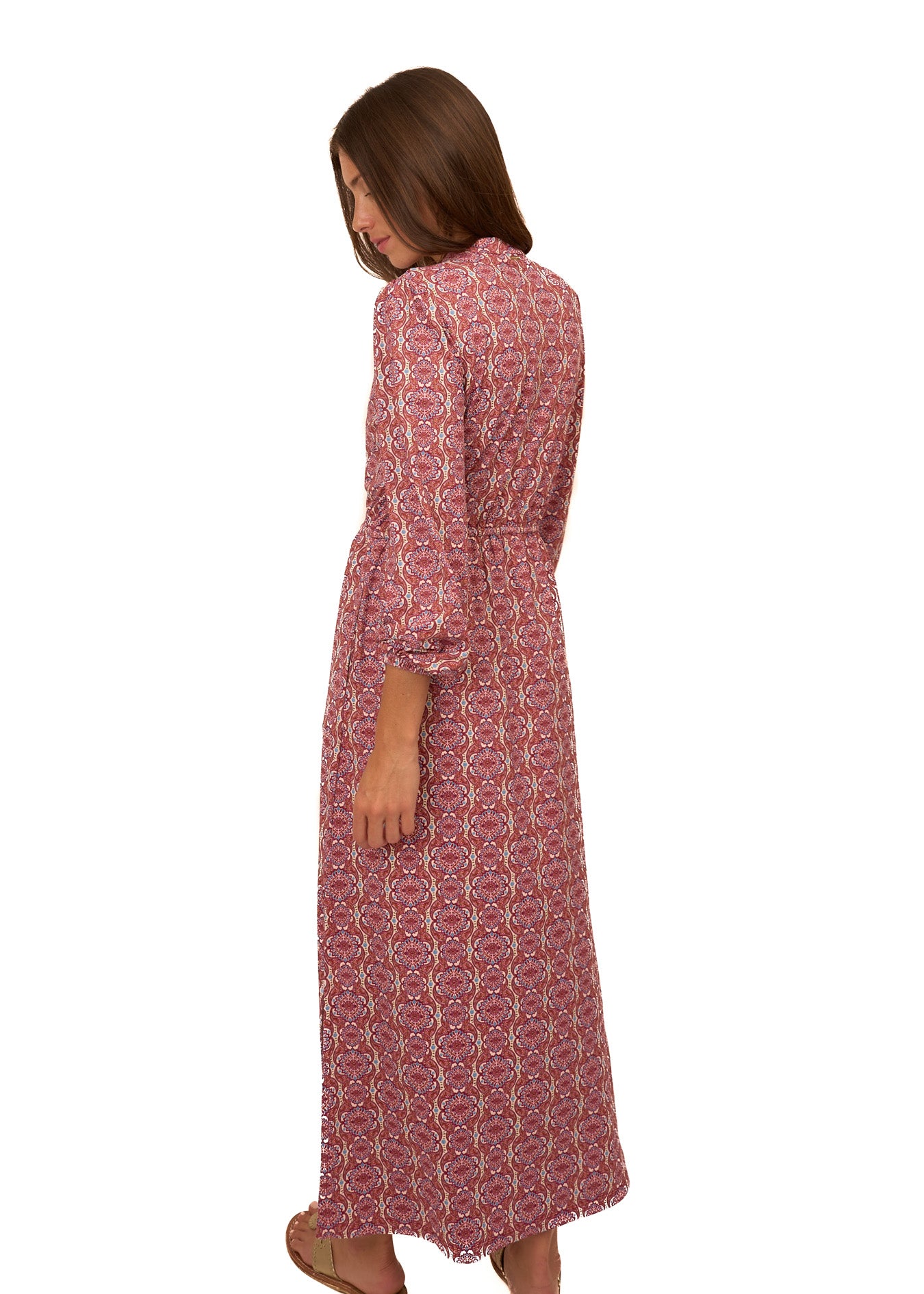 The back of a brunette woman wearing Cabana Life's sun protective Camden Geo Button Down Maxi Dress on a white background.