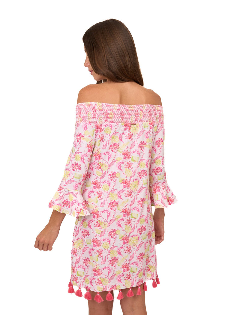 The back of a brunette woman wearing the sun protective Margarita Off The Shoulder Dress from Cabana Life on a white background.