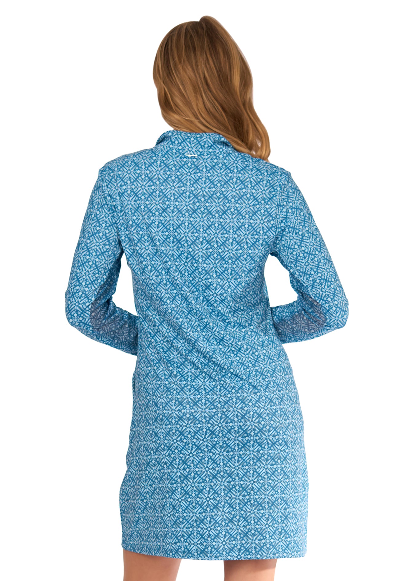 The back of a blonde woman wearing the sun protective and turquoise printed Camden 1/4 Zip Sport Dress from Cabana Life on a white background.