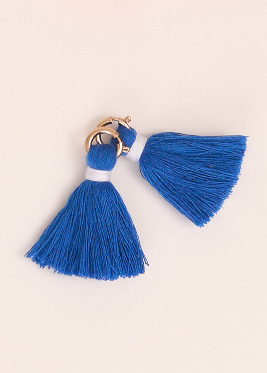 Cabana Life's Blue Game Day Tassel Set on top of each other on a white background.