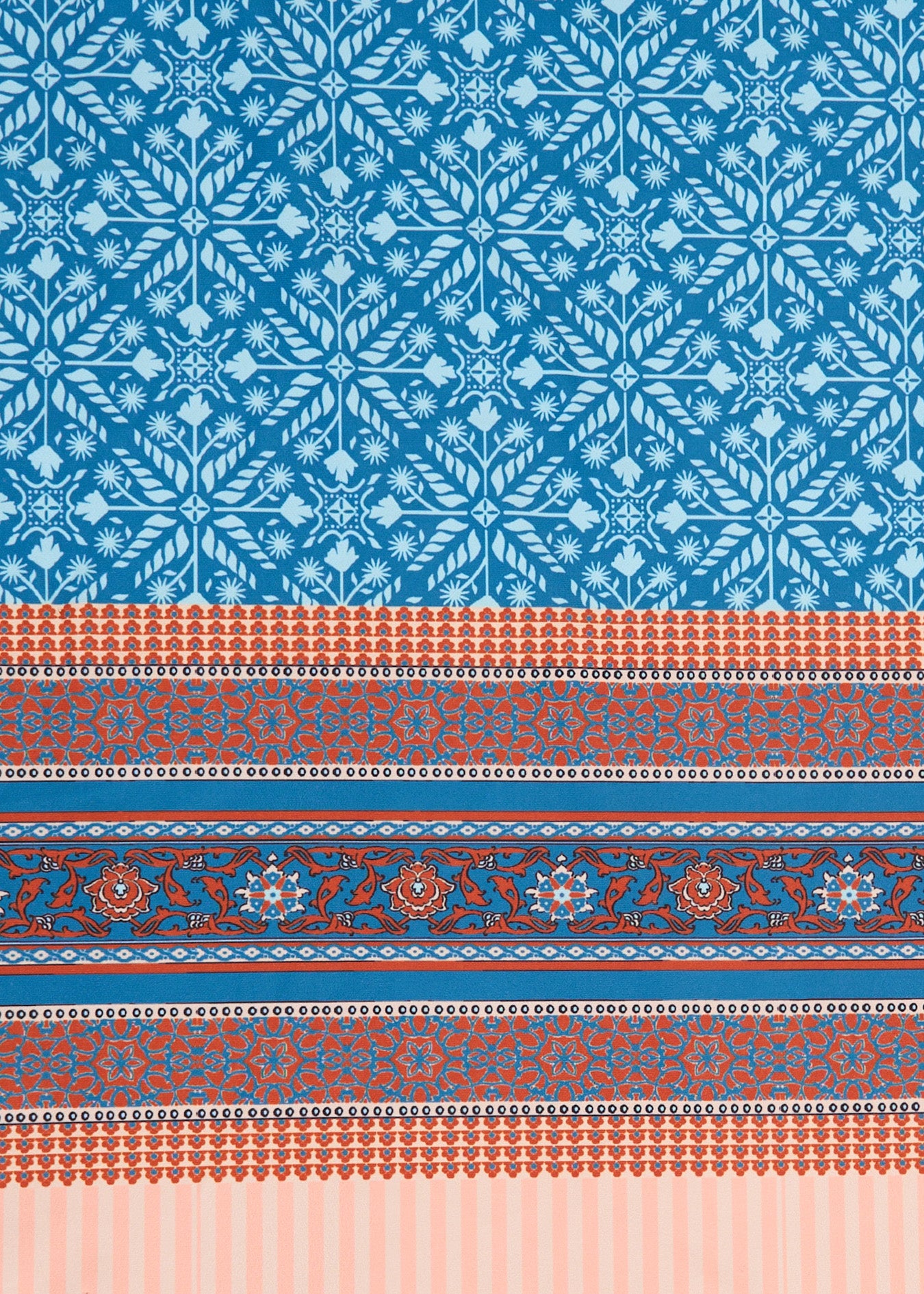 A close up of Cabana Life's teal and orange printed Camden Leaf pattern with a border on a sun protective fabric.