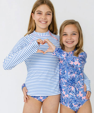 Girls wearing Cabana Life's sun protective swimwear.