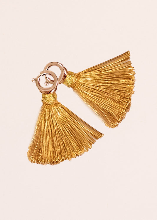 Cabana Life's Gold Game Day Tassel Set on top of each other on a white background.