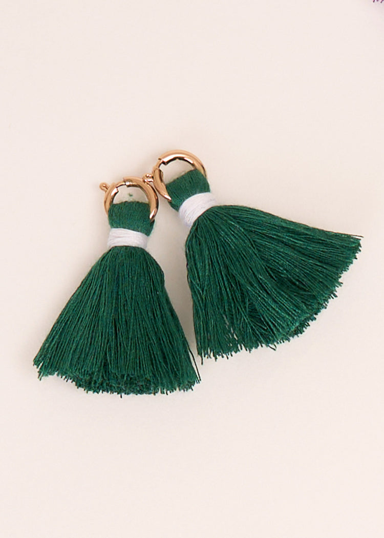 Cabana Life's Green Game Day Tassel Set on top of each other on a white background.