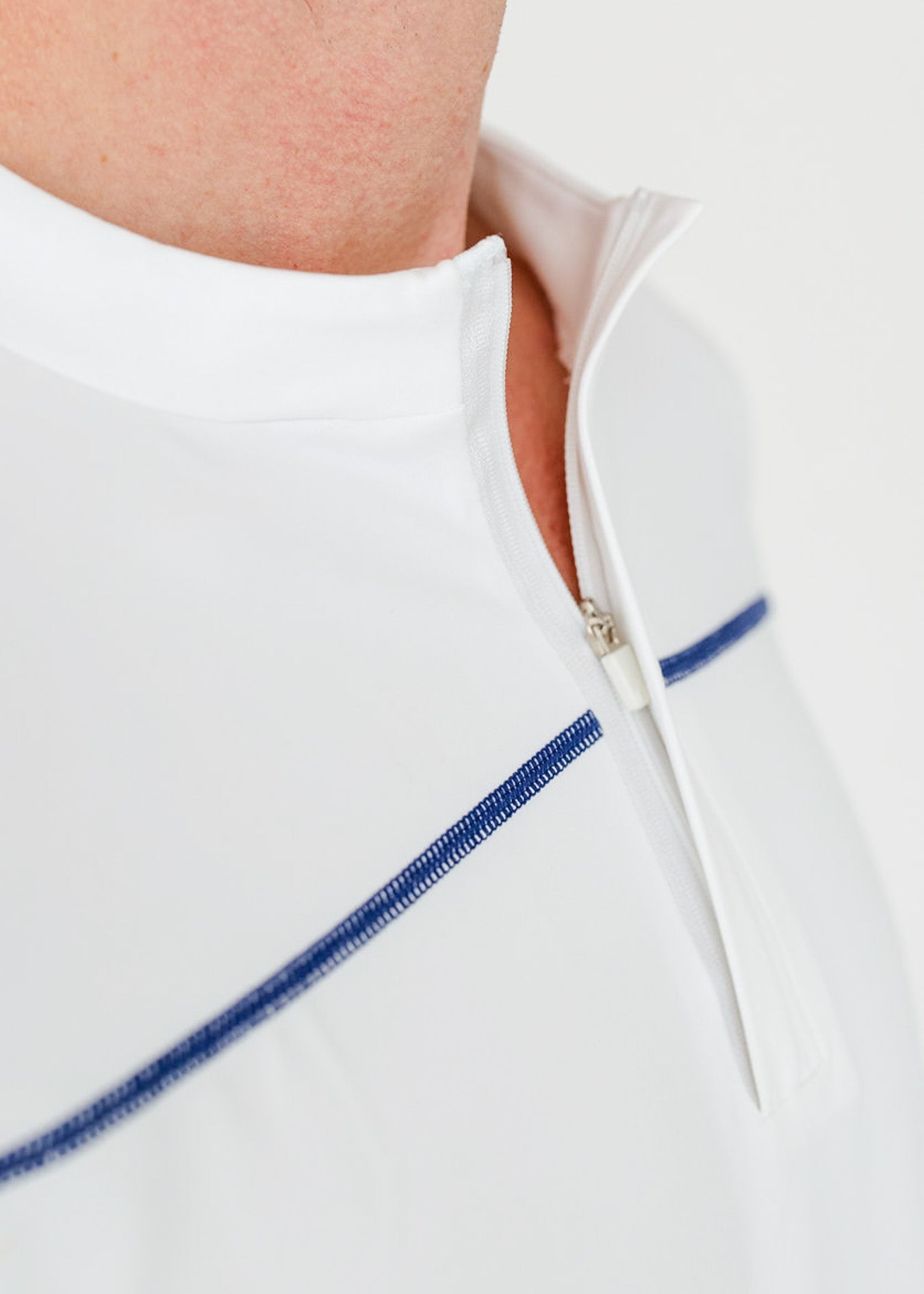 The zipper collar on the sun protective Men's White Sport Zip Top from Cabana Life.