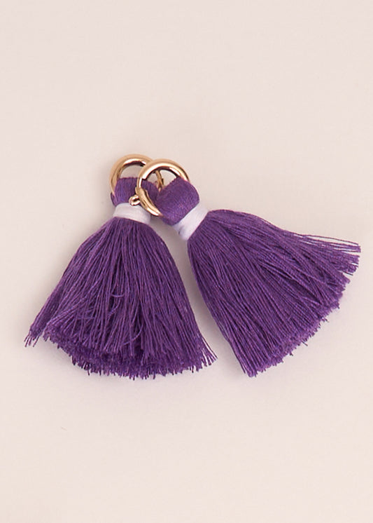 Cabana Life's Purple Game Day Tassel Set on top of each other on a white background.