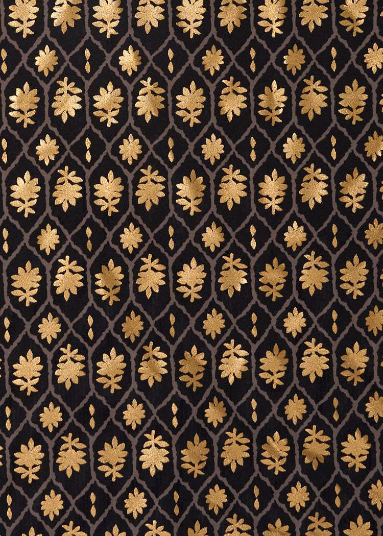 A close up of the black and gold printed Cabana Life sun protective fabric.