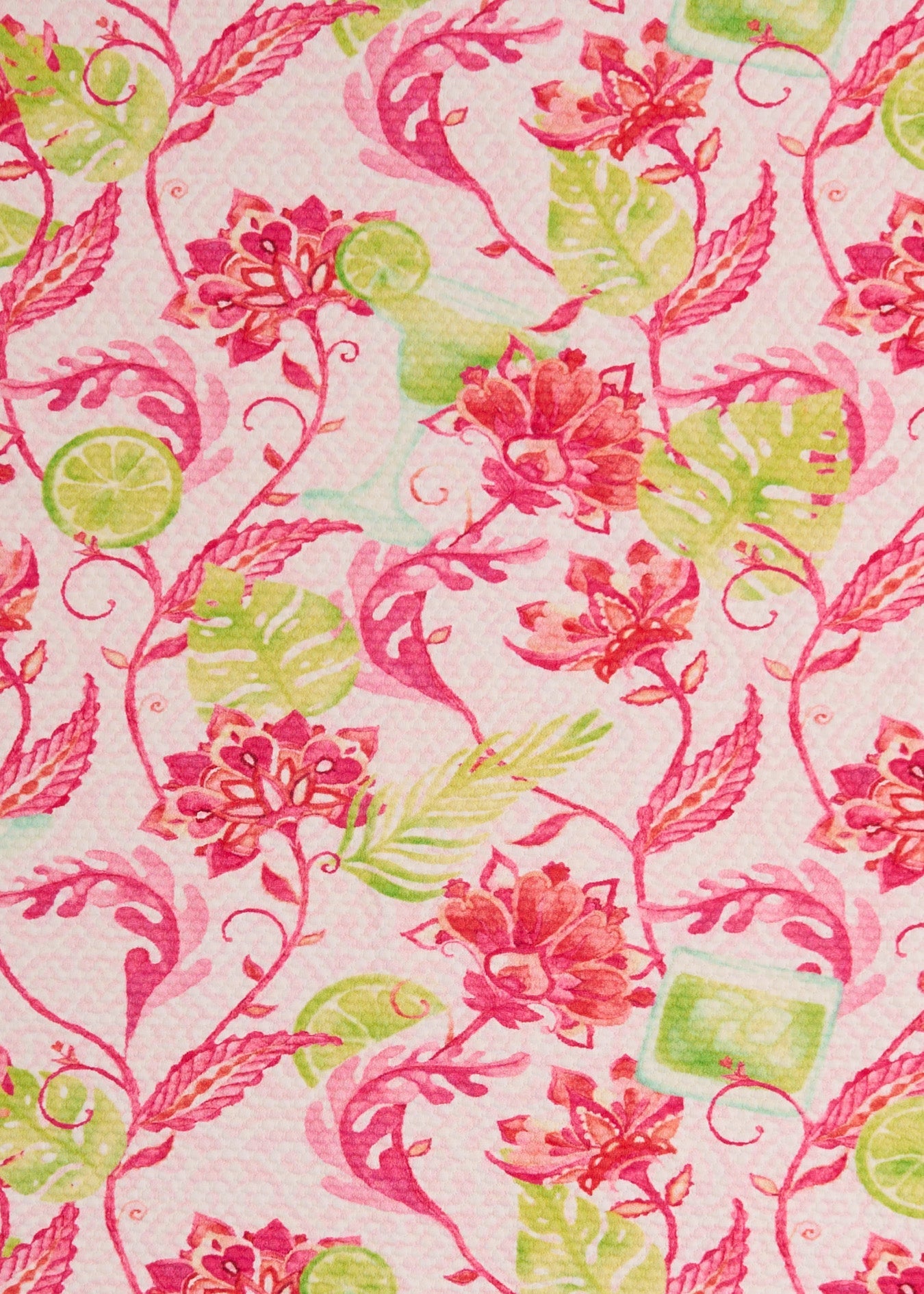 A close-up of Cabana Life's sun protective Margarita print pique fabric with pink flowers and lime margarita drink accents.