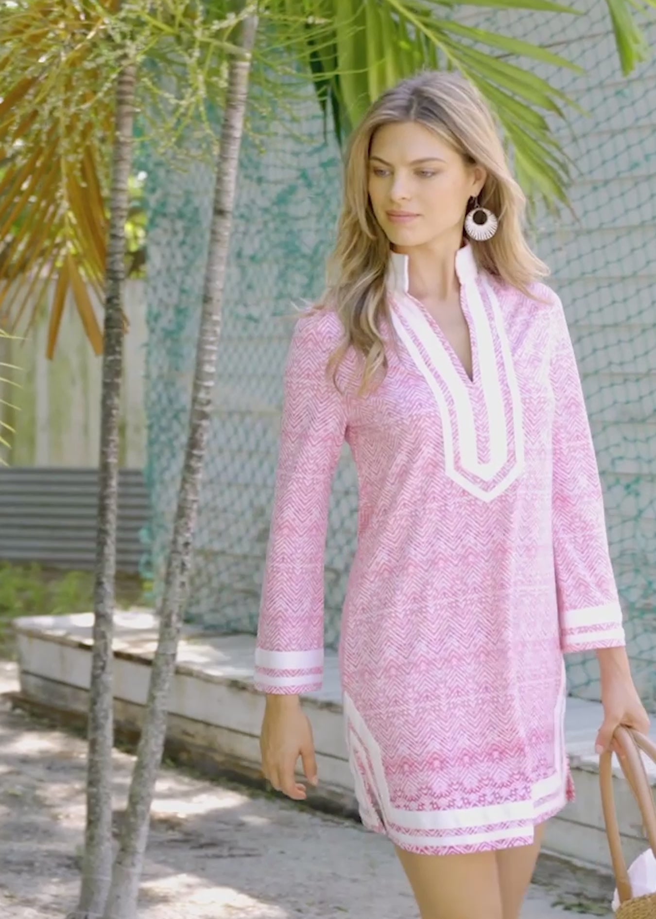 Clips of blonde women outside wearing the Cabana Life sun safe Algarve Tunic Dress.