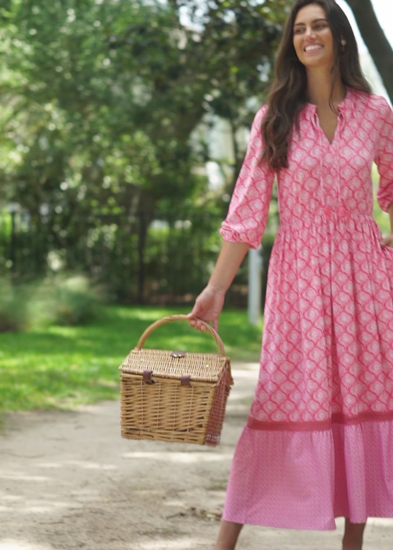 A video of a brunette woman outside wearing the Cabana Life sun protective Amelia Island Relaxed Maxi Dress.