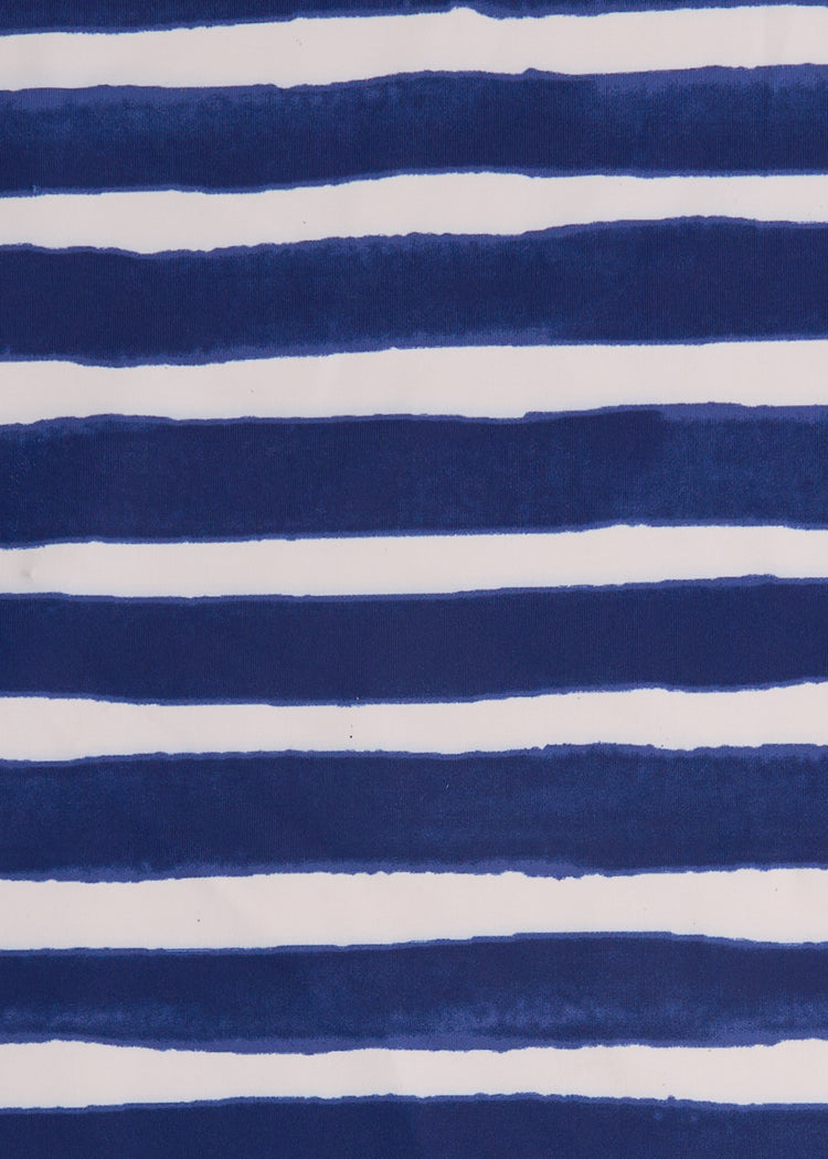 A close up of the water color navy stripe printed Cabana Life sun protective fabric.